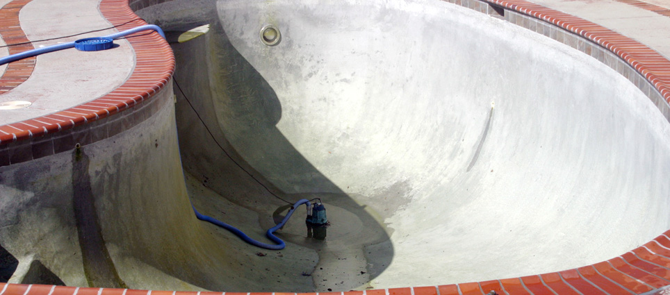 Black plaster pool with stains