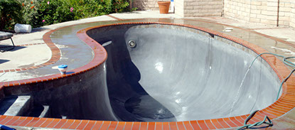 Black plaster pool with stains removed