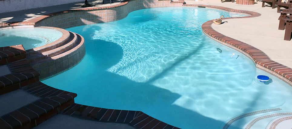 Finished pool with stains & algae after acid & chlorine washes