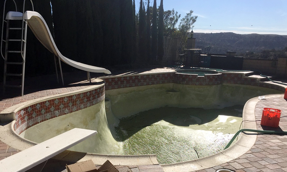 Pool with algae being removed