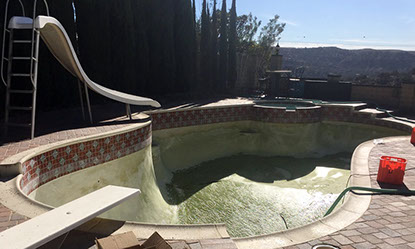 Pool with algae being removed