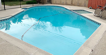 Finished pool with stains & algae after acid & chlorine washes